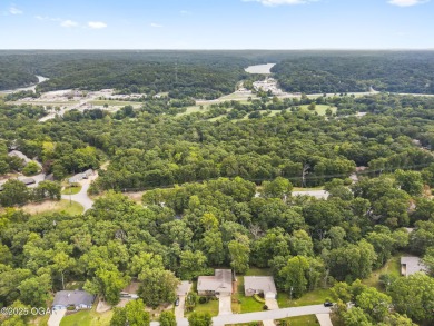 This 3-bedroom, 2-bath home has 1,676 sq. ft. of living space on Bella Vista Country Club and Golf Course in Arkansas - for sale on GolfHomes.com, golf home, golf lot