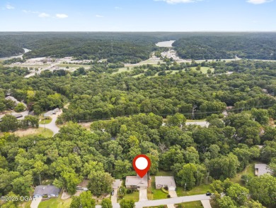 This 3-bedroom, 2-bath home has 1,676 sq. ft. of living space on Bella Vista Country Club and Golf Course in Arkansas - for sale on GolfHomes.com, golf home, golf lot