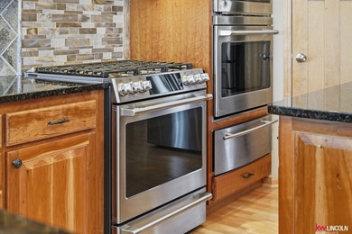 Come tour this amazing home on NuMark Golf Course. This on Pine Lake Golf and Tennis Club in Nebraska - for sale on GolfHomes.com, golf home, golf lot