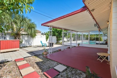 Savor the Florida lifestyle in this charming three-bedroom pool on Daytona Beach Golf Club in Florida - for sale on GolfHomes.com, golf home, golf lot