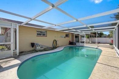 Savor the Florida lifestyle in this charming three-bedroom pool on Daytona Beach Golf Club in Florida - for sale on GolfHomes.com, golf home, golf lot