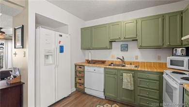 Experience the best of Lake of the Ozarks in this spacious on Seasons Ridge At Four Seasons in Missouri - for sale on GolfHomes.com, golf home, golf lot