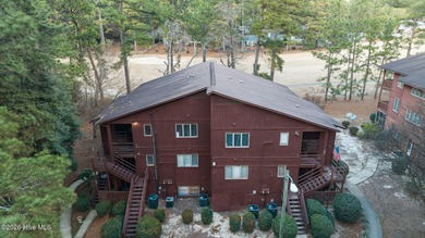 Nestled beneath a canopy of mature longleaf pines, this charming on Hyland Golf Club in North Carolina - for sale on GolfHomes.com, golf home, golf lot