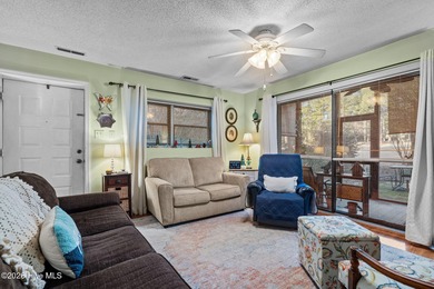 Nestled beneath a canopy of mature longleaf pines, this charming on Hyland Golf Club in North Carolina - for sale on GolfHomes.com, golf home, golf lot