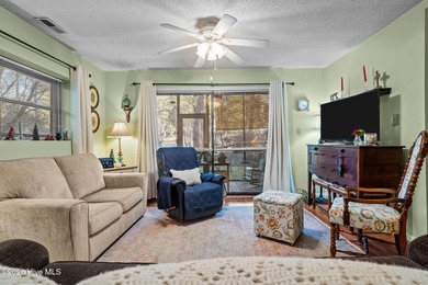 Nestled beneath a canopy of mature longleaf pines, this charming on Hyland Golf Club in North Carolina - for sale on GolfHomes.com, golf home, golf lot