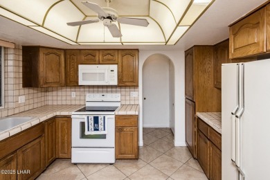 Welcome to 1811 Duel Dr. This original owner home is nestled on London Bridge Golf Course in Arizona - for sale on GolfHomes.com, golf home, golf lot
