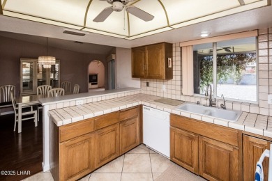 Welcome to 1811 Duel Dr. This original owner home is nestled on London Bridge Golf Course in Arizona - for sale on GolfHomes.com, golf home, golf lot