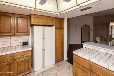 Welcome to 1811 Duel Dr. This original owner home is nestled on London Bridge Golf Course in Arizona - for sale on GolfHomes.com, golf home, golf lot