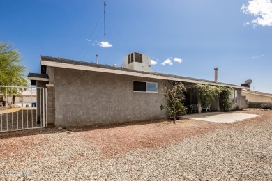 Welcome to 1811 Duel Dr. This original owner home is nestled on London Bridge Golf Course in Arizona - for sale on GolfHomes.com, golf home, golf lot