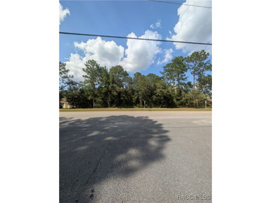 Build your dream home on this beautiful .58-acre homesite in on Pine Ridge Community Golf and Country Club in Florida - for sale on GolfHomes.com, golf home, golf lot
