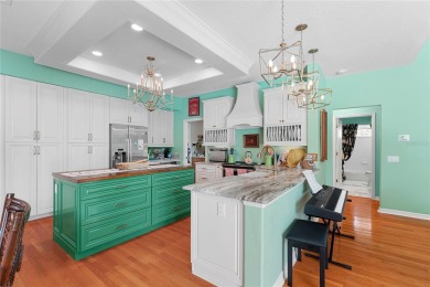 Discover a remarkable 4-bedroom, 3-bathroom pool home in the on Hunters Green Country Club in Florida - for sale on GolfHomes.com, golf home, golf lot
