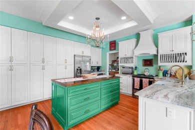 Discover a remarkable 4-bedroom, 3-bathroom pool home in the on Hunters Green Country Club in Florida - for sale on GolfHomes.com, golf home, golf lot
