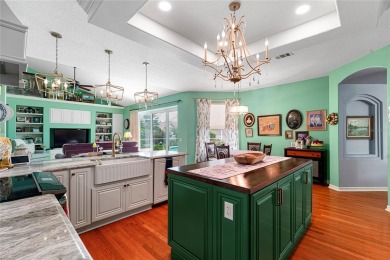 Discover a remarkable 4-bedroom, 3-bathroom pool home in the on Hunters Green Country Club in Florida - for sale on GolfHomes.com, golf home, golf lot
