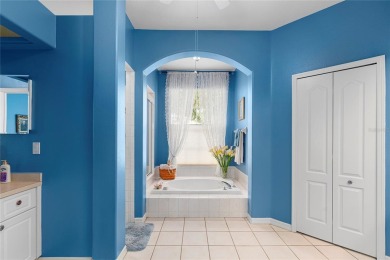 Discover a remarkable 4-bedroom, 3-bathroom pool home in the on Hunters Green Country Club in Florida - for sale on GolfHomes.com, golf home, golf lot
