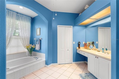 Discover a remarkable 4-bedroom, 3-bathroom pool home in the on Hunters Green Country Club in Florida - for sale on GolfHomes.com, golf home, golf lot