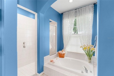 Discover a remarkable 4-bedroom, 3-bathroom pool home in the on Hunters Green Country Club in Florida - for sale on GolfHomes.com, golf home, golf lot