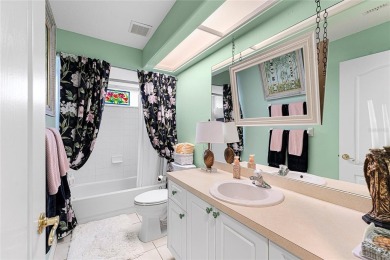 Discover a remarkable 4-bedroom, 3-bathroom pool home in the on Hunters Green Country Club in Florida - for sale on GolfHomes.com, golf home, golf lot