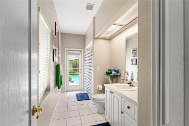 Discover a remarkable 4-bedroom, 3-bathroom pool home in the on Hunters Green Country Club in Florida - for sale on GolfHomes.com, golf home, golf lot