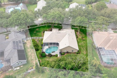 Discover a remarkable 4-bedroom, 3-bathroom pool home in the on Hunters Green Country Club in Florida - for sale on GolfHomes.com, golf home, golf lot