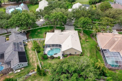 Discover a remarkable 4-bedroom, 3-bathroom pool home in the on Hunters Green Country Club in Florida - for sale on GolfHomes.com, golf home, golf lot