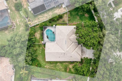 Discover a remarkable 4-bedroom, 3-bathroom pool home in the on Hunters Green Country Club in Florida - for sale on GolfHomes.com, golf home, golf lot