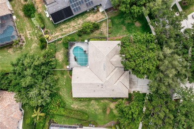 Discover a remarkable 4-bedroom, 3-bathroom pool home in the on Hunters Green Country Club in Florida - for sale on GolfHomes.com, golf home, golf lot