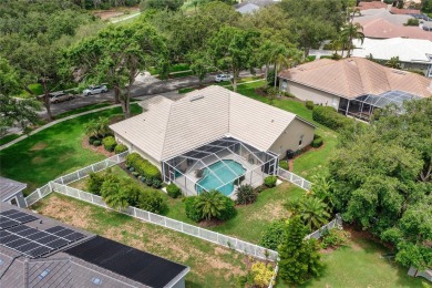 Discover a remarkable 4-bedroom, 3-bathroom pool home in the on Hunters Green Country Club in Florida - for sale on GolfHomes.com, golf home, golf lot