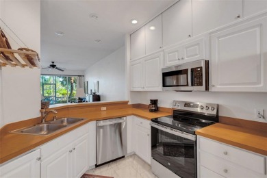 Maintenance-Free Luxury Living with Waterfall Views in on Grasslands Golf and Country Club in Florida - for sale on GolfHomes.com, golf home, golf lot