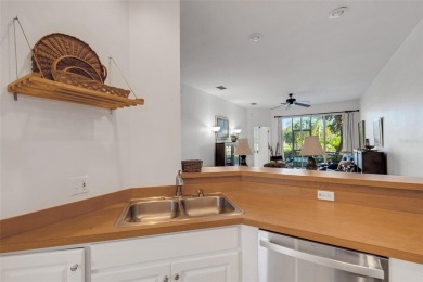 Maintenance-Free Luxury Living with Waterfall Views in on Grasslands Golf and Country Club in Florida - for sale on GolfHomes.com, golf home, golf lot