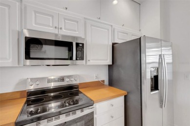 Maintenance-Free Luxury Living with Waterfall Views in on Grasslands Golf and Country Club in Florida - for sale on GolfHomes.com, golf home, golf lot