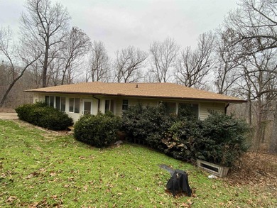 Tucked away on a quiet cul-de-sac in the heart of Cherokee on Cherokee Village South Course in Arkansas - for sale on GolfHomes.com, golf home, golf lot