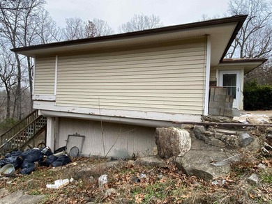 Tucked away on a quiet cul-de-sac in the heart of Cherokee on Cherokee Village South Course in Arkansas - for sale on GolfHomes.com, golf home, golf lot