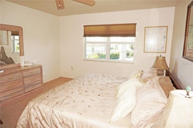 Impressive second floor light and bright END UNIT offers views on Saint Andrews South Golf Club in Florida - for sale on GolfHomes.com, golf home, golf lot
