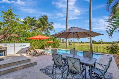 This luxurious 3 bedroom/2 bath home sits directly on famed Lake on Lake Worth Municipal Golf Course in Florida - for sale on GolfHomes.com, golf home, golf lot