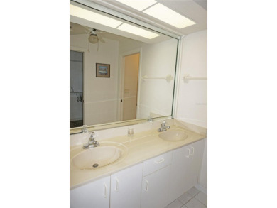 Impressive second floor light and bright END UNIT offers views on Saint Andrews South Golf Club in Florida - for sale on GolfHomes.com, golf home, golf lot
