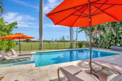 This luxurious 3 bedroom/2 bath home sits directly on famed Lake on Lake Worth Municipal Golf Course in Florida - for sale on GolfHomes.com, golf home, golf lot