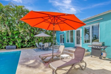 This luxurious 3 bedroom/2 bath home sits directly on famed Lake on Lake Worth Municipal Golf Course in Florida - for sale on GolfHomes.com, golf home, golf lot