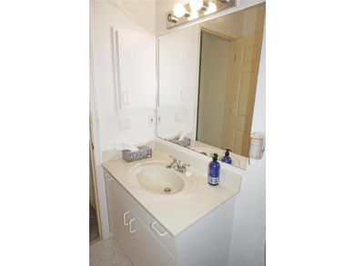 Impressive second floor light and bright END UNIT offers views on Saint Andrews South Golf Club in Florida - for sale on GolfHomes.com, golf home, golf lot