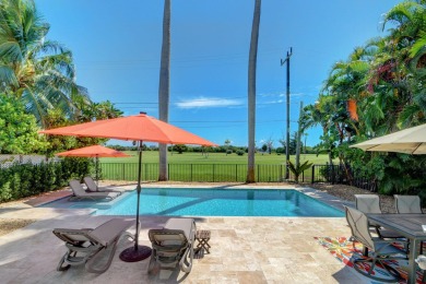 This luxurious 3 bedroom/2 bath home sits directly on famed Lake on Lake Worth Municipal Golf Course in Florida - for sale on GolfHomes.com, golf home, golf lot