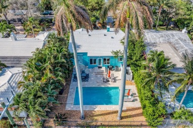 This luxurious 3 bedroom/2 bath home sits directly on famed Lake on Lake Worth Municipal Golf Course in Florida - for sale on GolfHomes.com, golf home, golf lot