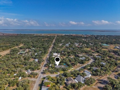Tucked beneath a canopy of majestic coastal live oaks in the on Lamar Golf Course in Texas - for sale on GolfHomes.com, golf home, golf lot