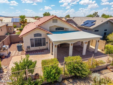 Nestled on a tranquil cul-de-sac along the 2nd fairway of Coyote on Coyote Lakes Golf Club in Arizona - for sale on GolfHomes.com, golf home, golf lot
