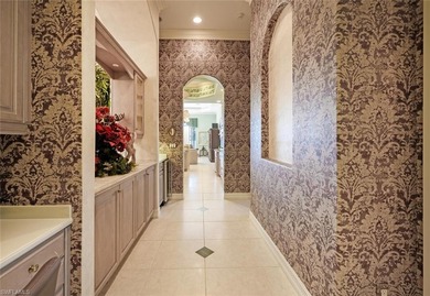Regal in design and grand in proportion, this residence on Kensington Golf and Country Club in Florida - for sale on GolfHomes.com, golf home, golf lot