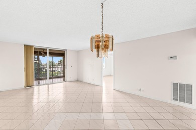 This impeccably maintained 2-bedroom, 2-bath condo with gorgeous on Marina Lakes Golf Course in Florida - for sale on GolfHomes.com, golf home, golf lot