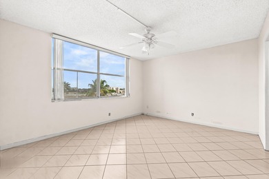 This impeccably maintained 2-bedroom, 2-bath condo with gorgeous on Marina Lakes Golf Course in Florida - for sale on GolfHomes.com, golf home, golf lot