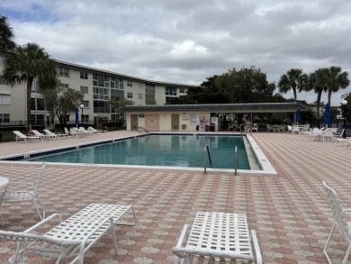 Wow, what a view! This 2-bedroom, 2-bath deluxe ground-floor on Wynmoor Golf Course in Florida - for sale on GolfHomes.com, golf home, golf lot