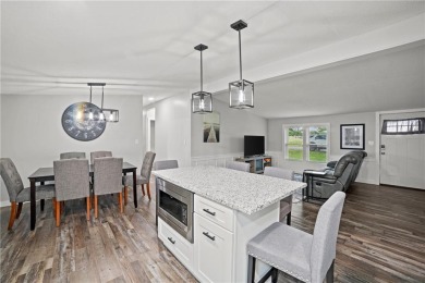 This remodeled ranch home in a gated community boasts four on Linn Valley Lakes - Deer Trace Golf Course in Kansas - for sale on GolfHomes.com, golf home, golf lot