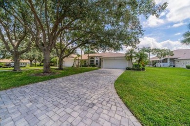 This gorgeous home has it all!  Check out the curb appeal of the on Falcon Watch Golf Club in Florida - for sale on GolfHomes.com, golf home, golf lot