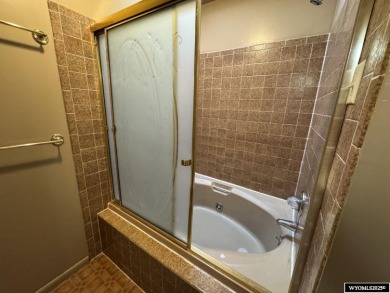 Welcome home to this thoughtfully updated tri-level townhouse on Riverton Country Club in Wyoming - for sale on GolfHomes.com, golf home, golf lot