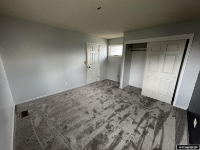 Welcome home to this thoughtfully updated tri-level townhouse on Riverton Country Club in Wyoming - for sale on GolfHomes.com, golf home, golf lot